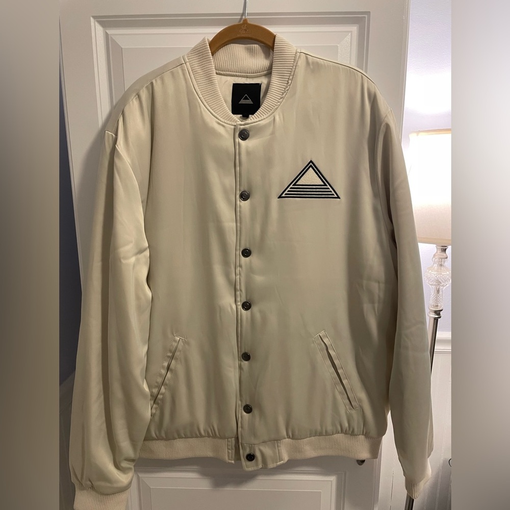 Stylish Cream Bomber Jacket with Geometric Logo